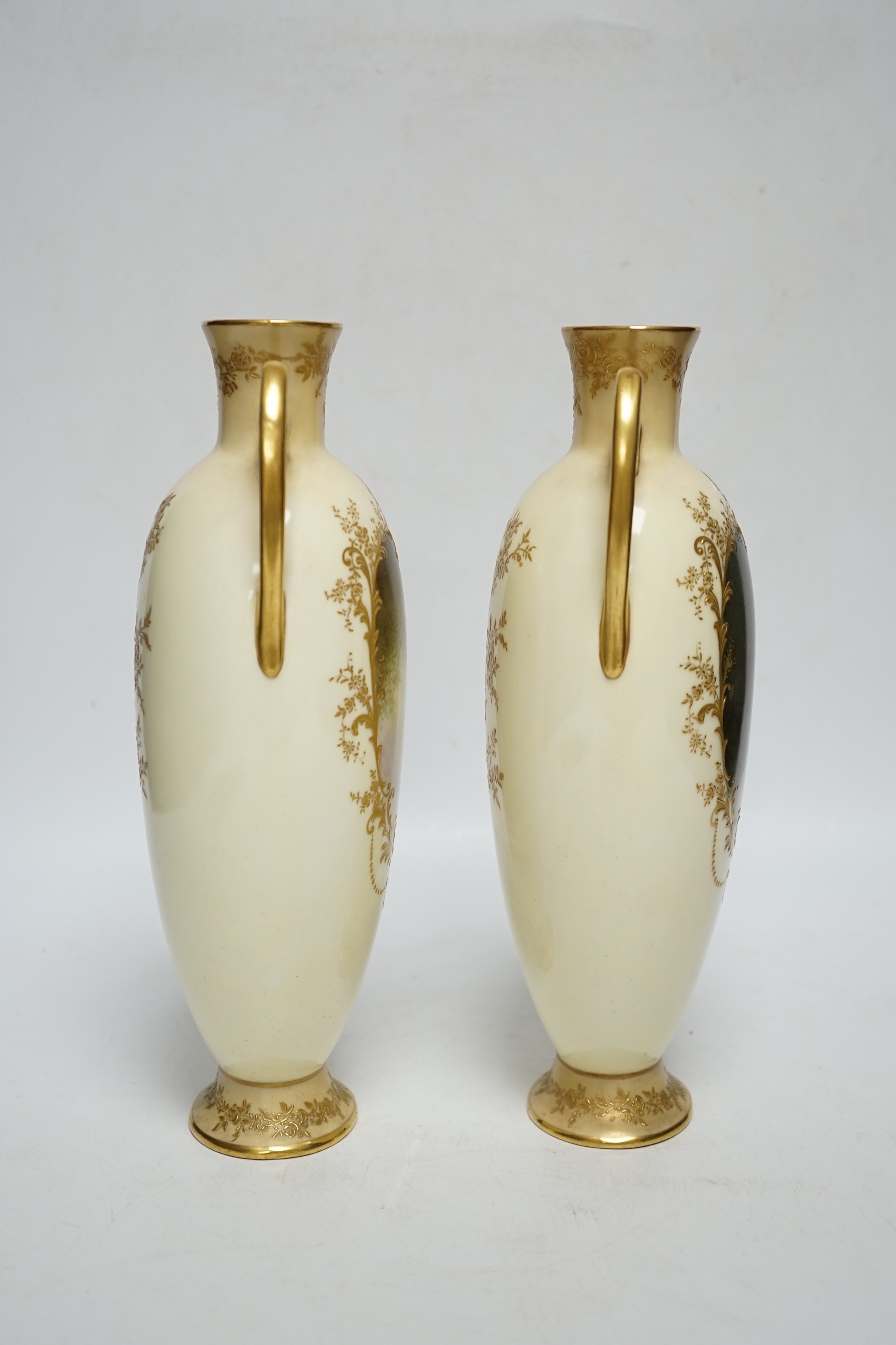 A pair of Royal Doulton vases painted with female portraits, by Henri Boullemier, 25.5cm